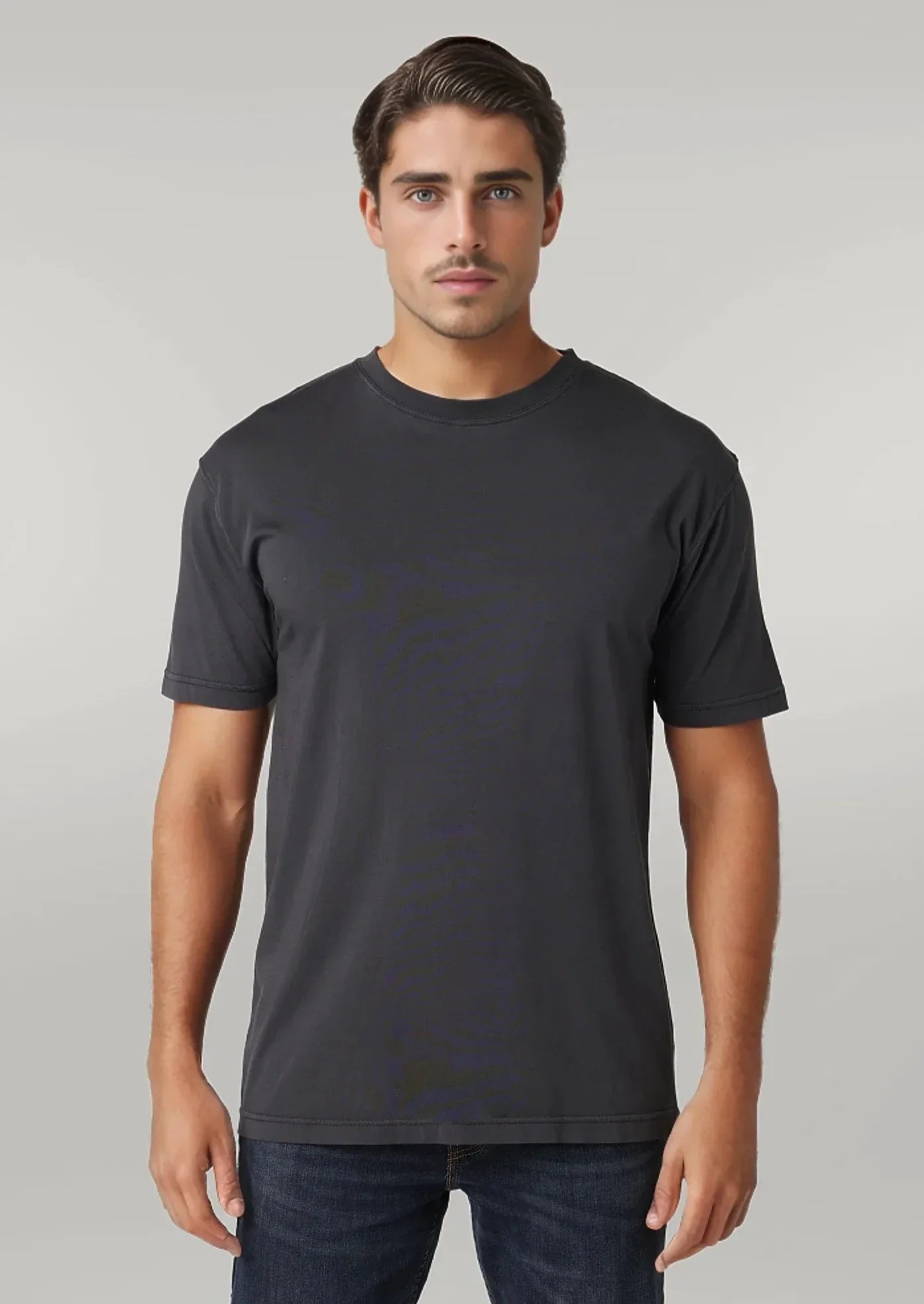 A male model wearing a blue short-sleeved crew neck t-shirt.