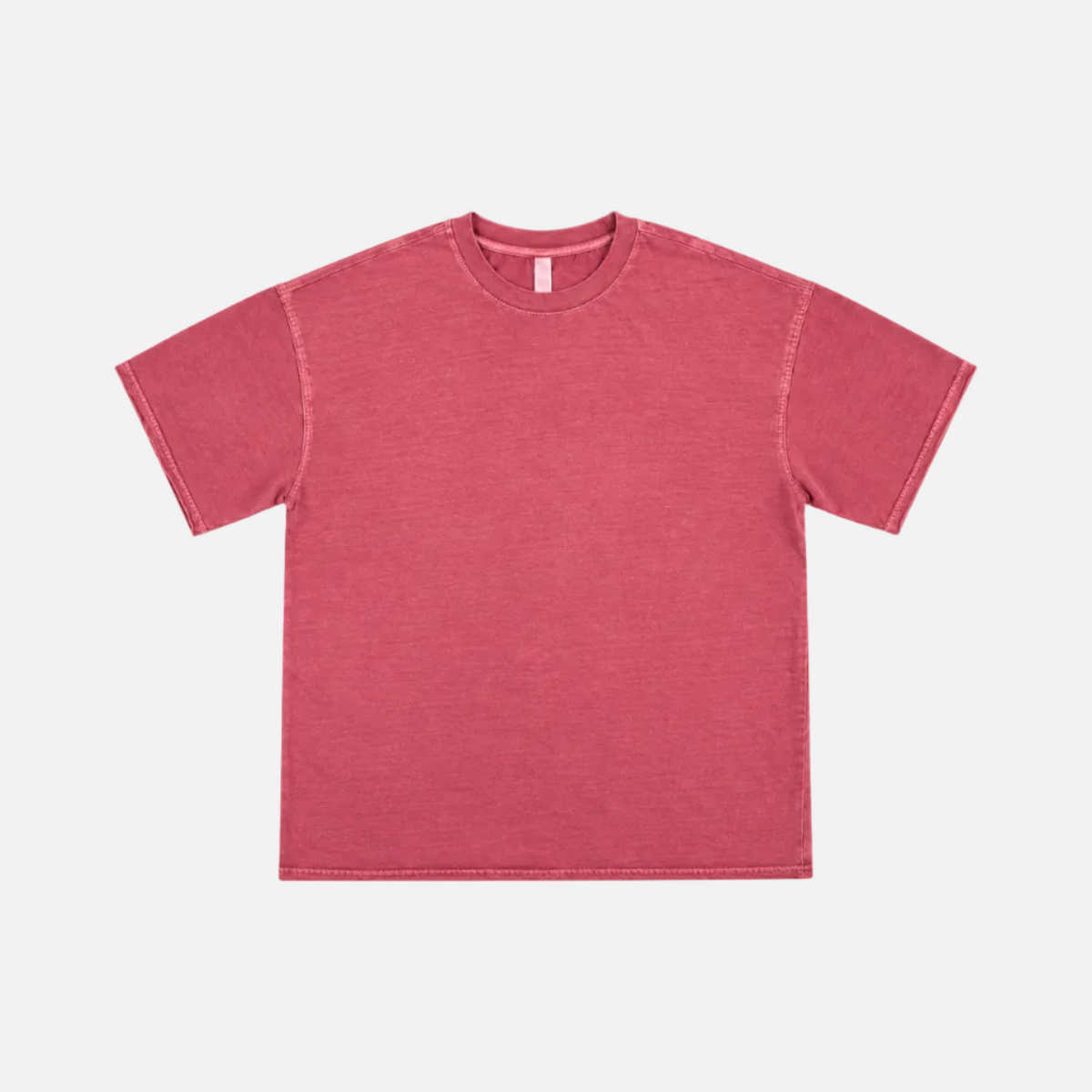 AF770 WOMEN PIGMENT DYED BOXY TEE is a short-sleeve crewneck t-shirt in a washed, heathered pinkish-red color, laid flat against a light gray background.