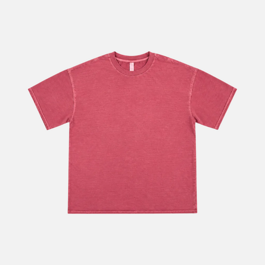 AF770 WOMEN PIGMENT DYED BOXY TEE is a short-sleeve crewneck t-shirt in a washed, heathered pinkish-red color, laid flat against a light gray background.