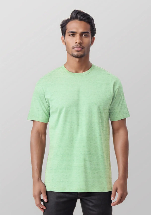 Man wearing a light green t-shirt against a plain background
