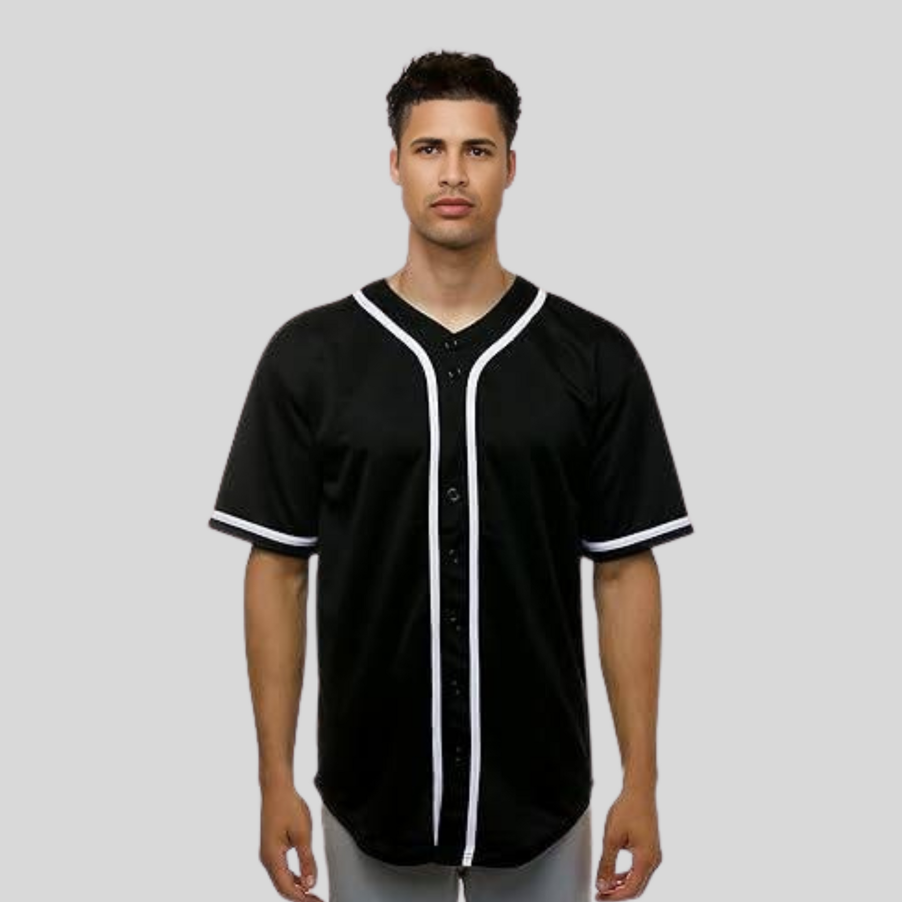 Man wearing a black baseball jersey with white accents on a gray background